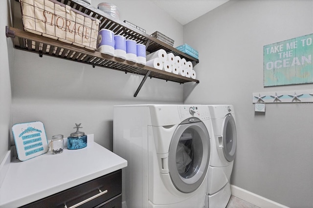 clothes washing area featuring independent washer and dryer