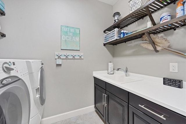 clothes washing area with cabinets, sink, separate washer and dryer, and light tile patterned flooring