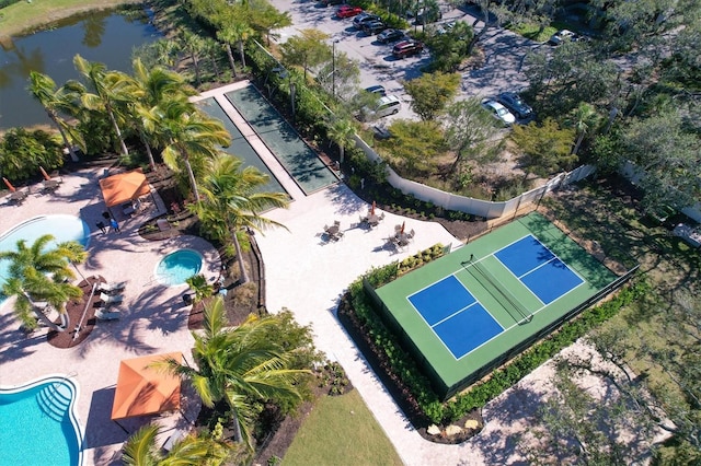 birds eye view of property with a water view