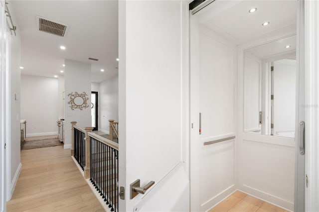 hallway featuring light wood-type flooring