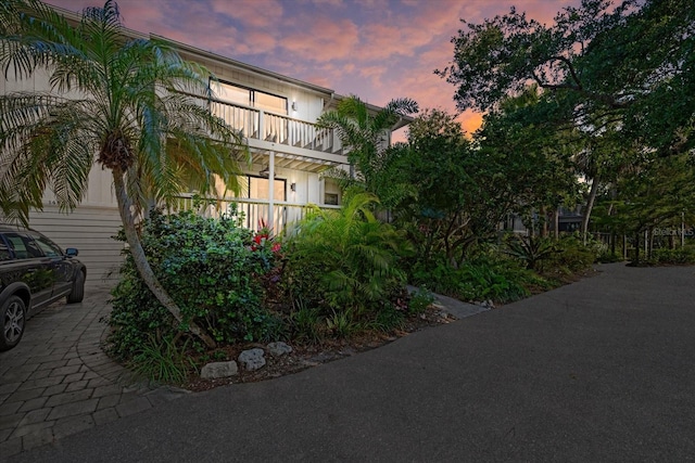 view of front of house featuring a balcony