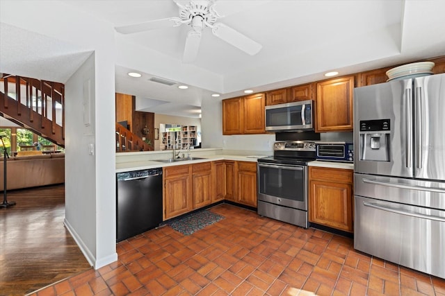 kitchen featuring ceiling fan, sink, and appliances with stainless steel finishes