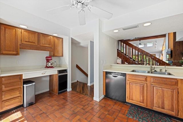 kitchen featuring dishwasher, ceiling fan, and sink