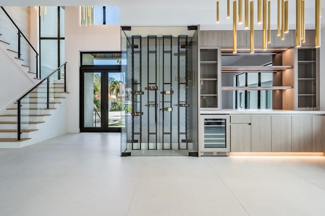 foyer entrance with wine cooler and french doors