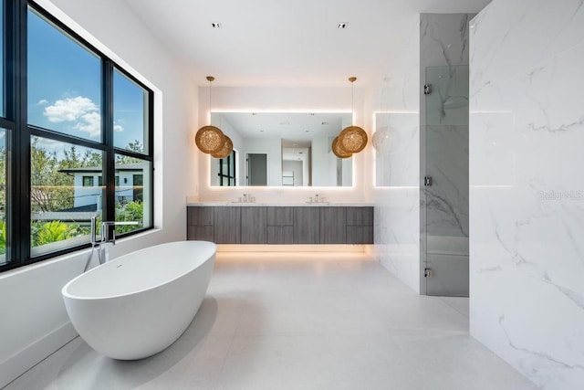 bathroom featuring vanity and plus walk in shower