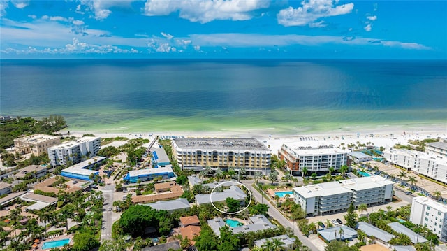 drone / aerial view featuring a view of the beach and a water view