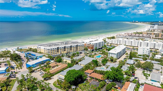 birds eye view of property featuring a water view and a view of the beach