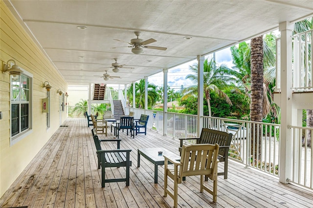 wooden terrace featuring ceiling fan