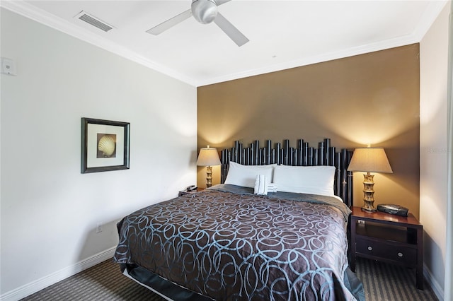 bedroom with ornamental molding, ceiling fan, and carpet