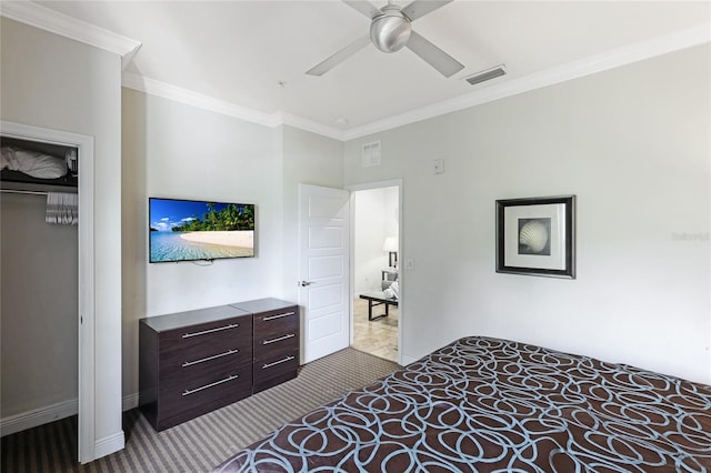 bedroom featuring light colored carpet, ceiling fan, ornamental molding, and a closet