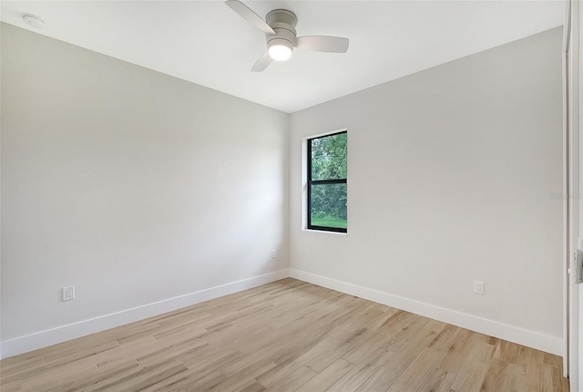 unfurnished room featuring baseboards, ceiling fan, and light wood finished floors