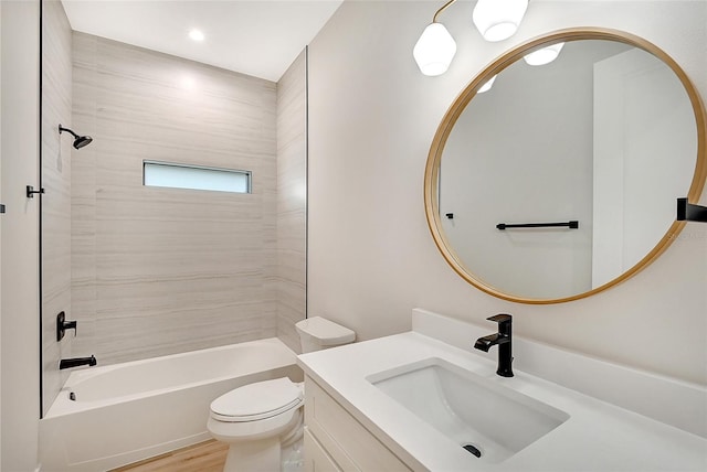 full bath featuring shower / bath combination, vanity, toilet, and wood finished floors