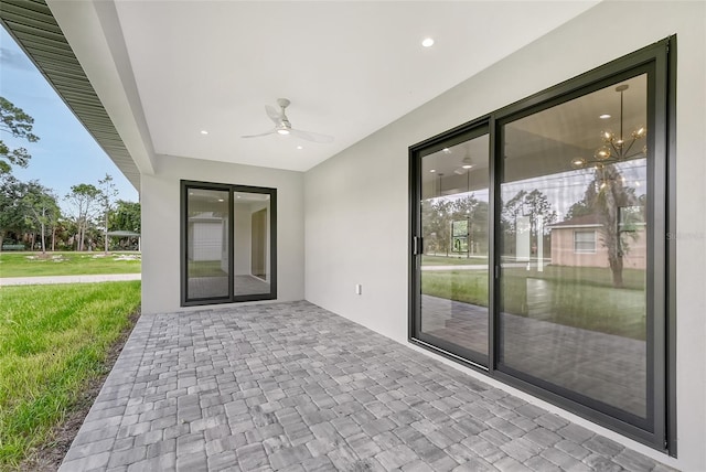 view of patio / terrace featuring ceiling fan