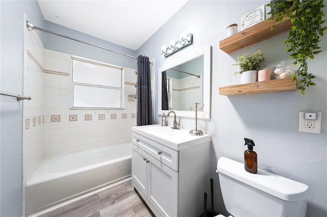 full bathroom with vanity, toilet, shower / tub combo with curtain, and hardwood / wood-style flooring