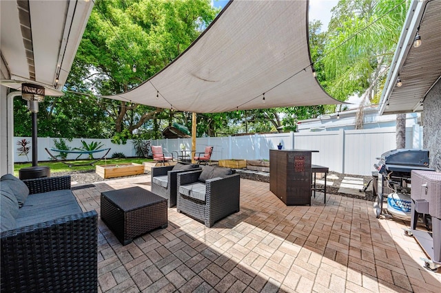 view of patio / terrace featuring an outdoor living space and grilling area