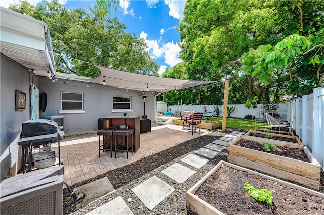 view of patio featuring a grill