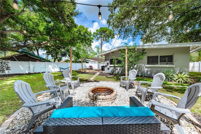 view of patio / terrace featuring an outdoor fire pit