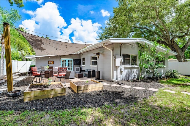 rear view of house featuring a patio area