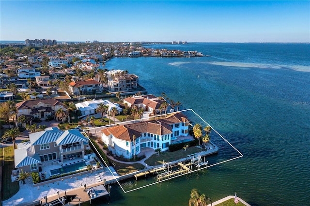 birds eye view of property featuring a water view