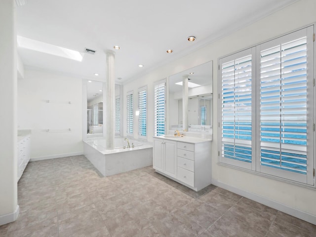 bathroom featuring vanity, a bathtub, and crown molding