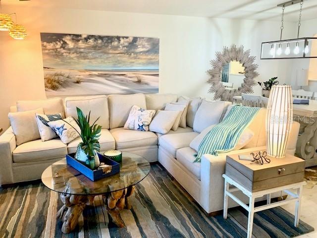 8630 Midnight Pass Rd Unit 103A, Sarasota, FL 34242 - living area featuring wood finished floors