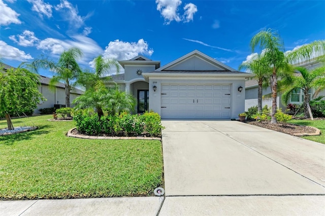 ranch-style house featuring a garage and a front yard