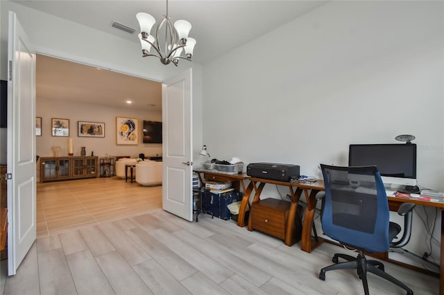 office space featuring a chandelier and light hardwood / wood-style flooring