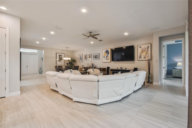 living room with ceiling fan