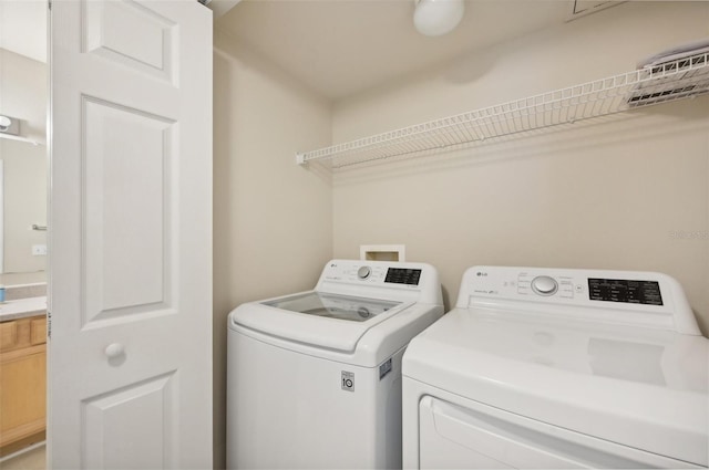 laundry room featuring washer and clothes dryer