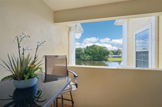 balcony featuring a water view