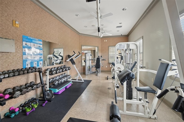 exercise room with ceiling fan and ornamental molding