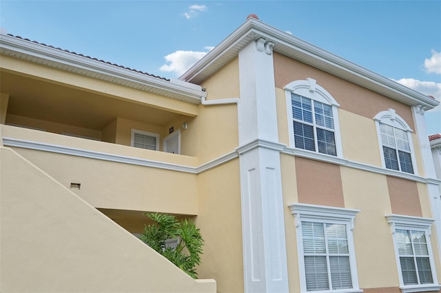 view of side of property featuring stucco siding