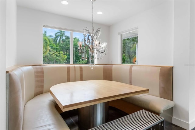 dining area featuring an inviting chandelier and a wealth of natural light