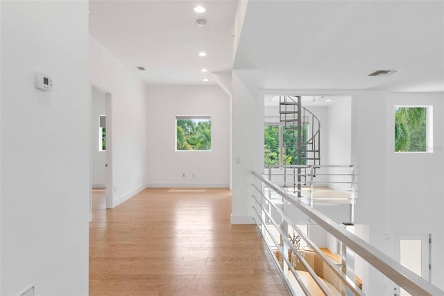 hall with light hardwood / wood-style flooring