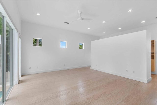 empty room featuring ceiling fan and light wood-type flooring