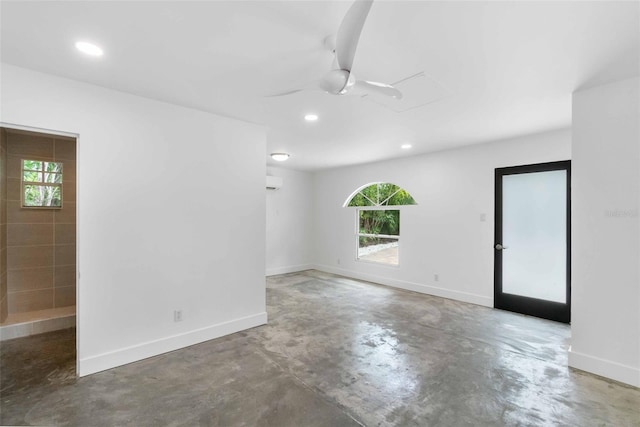 empty room featuring concrete flooring and ceiling fan