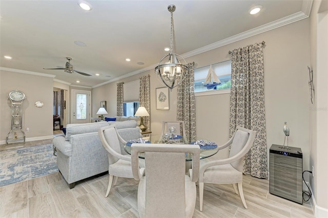 dining area with ornamental molding, ceiling fan with notable chandelier, and heating unit