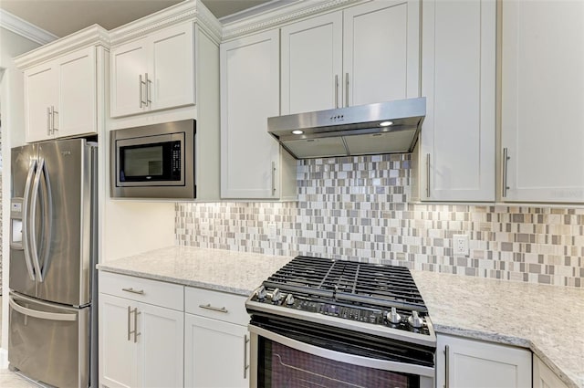 kitchen with ornamental molding, stainless steel appliances, light stone countertops, decorative backsplash, and white cabinets