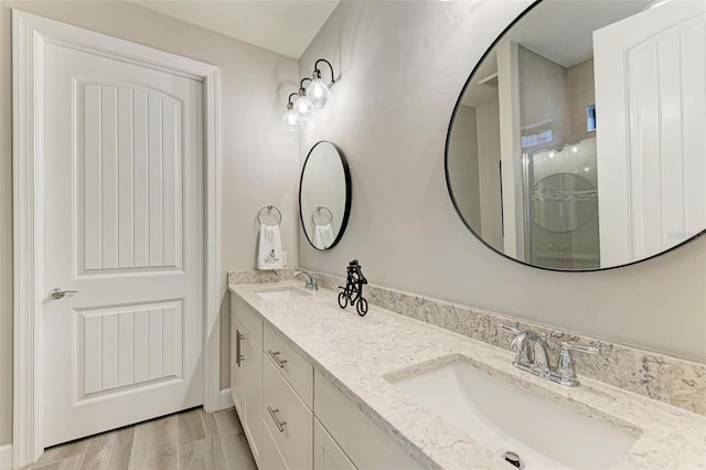 bathroom with vanity and a shower