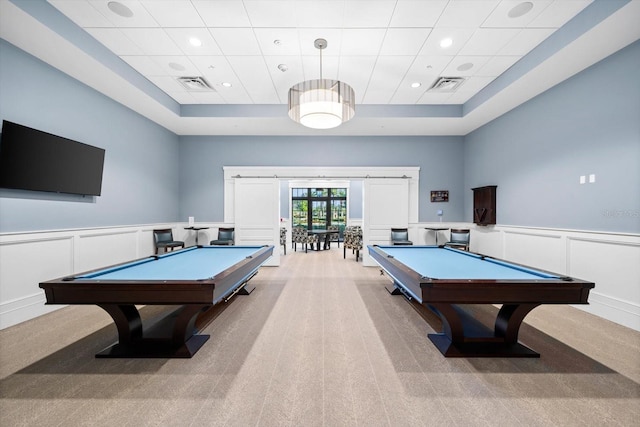 game room with light carpet, pool table, and a drop ceiling