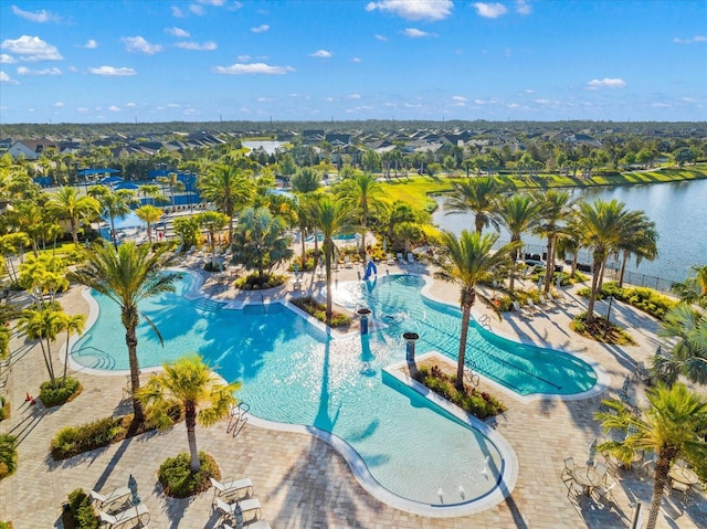 view of pool with a water view and a patio area