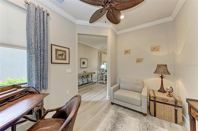 home office with ornamental molding, ceiling fan, and light hardwood / wood-style floors