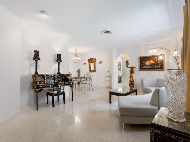 living room with an inviting chandelier