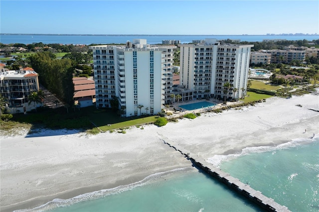 drone / aerial view with a view of the beach and a water view