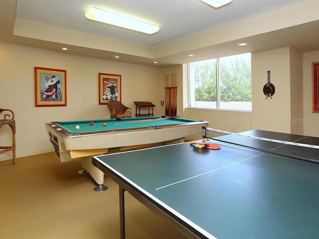 playroom with a tray ceiling, pool table, and carpet