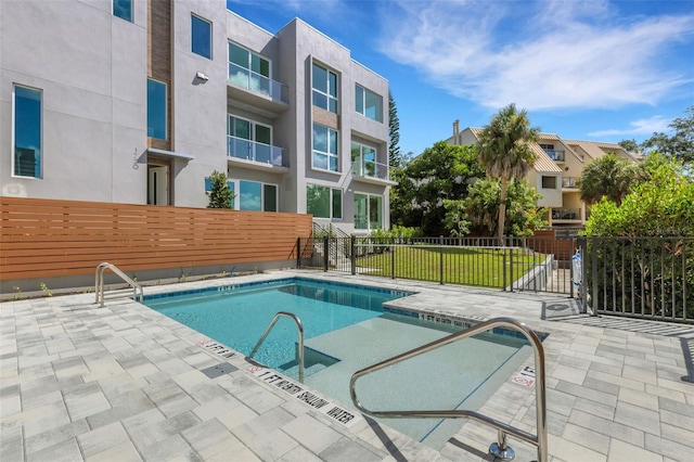 view of swimming pool featuring a patio area