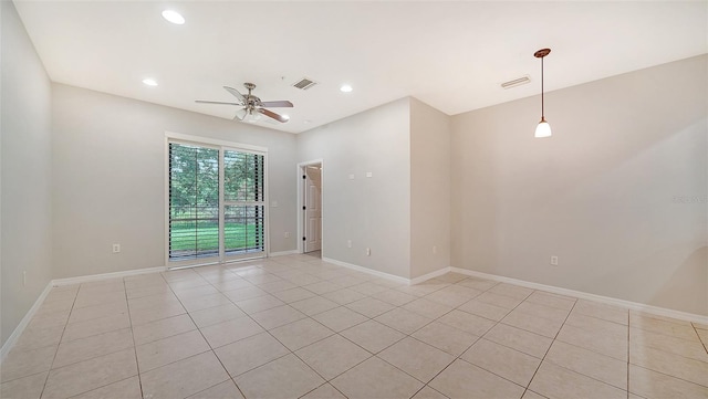 empty room featuring light tile patterned floors and ceiling fan