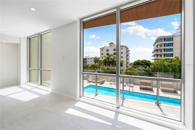 doorway featuring a wealth of natural light and floor to ceiling windows