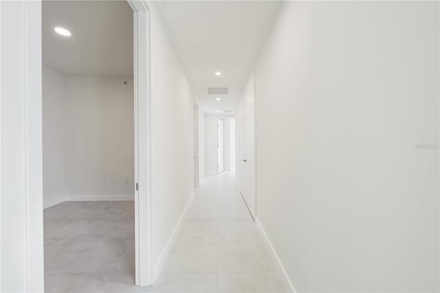 corridor featuring light tile patterned floors