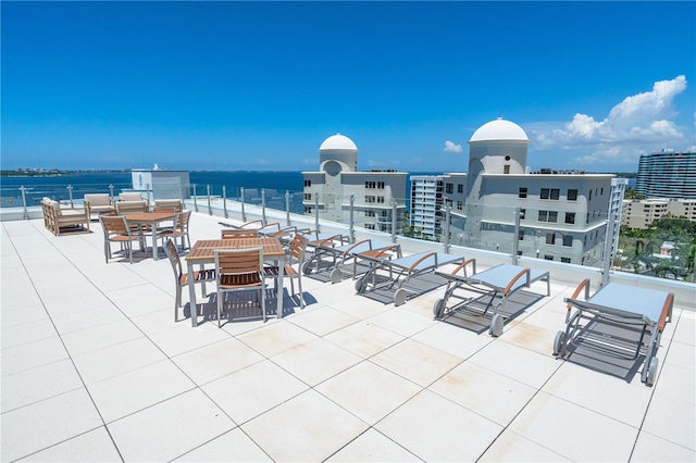 view of patio with a water view